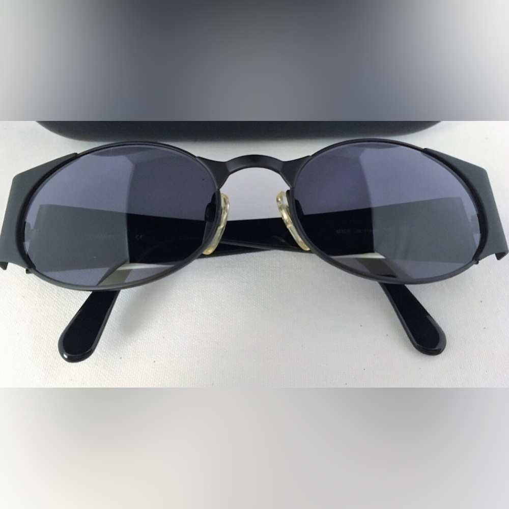 Chanel black oval sunglasses, circa 1995, adjustable nose pads